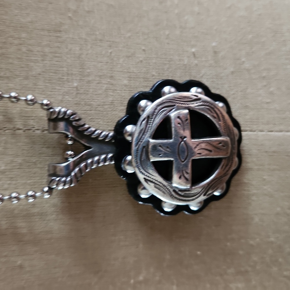 Edgy cross necklace.